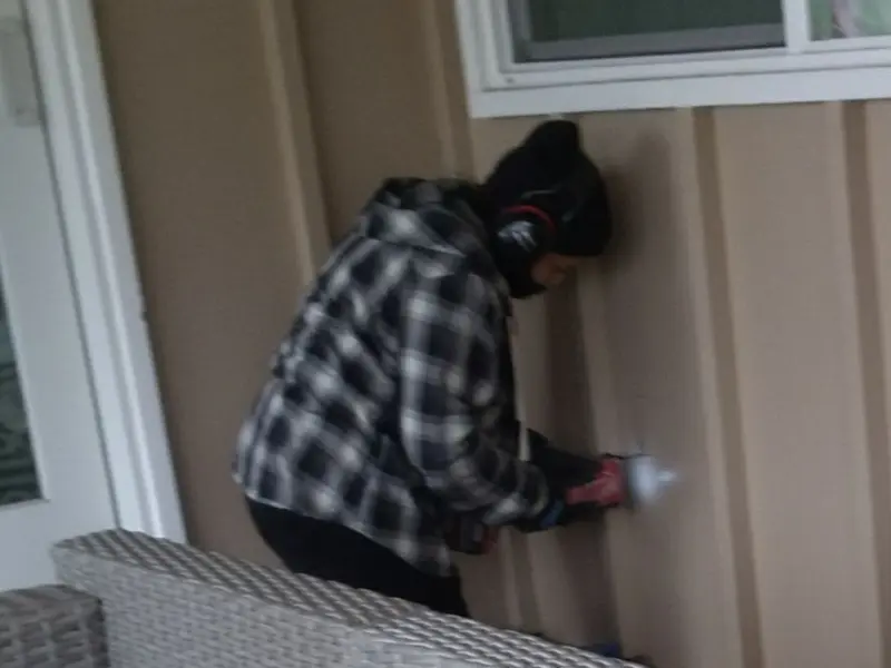 Professional electrician installing an exterior outlet in Azle