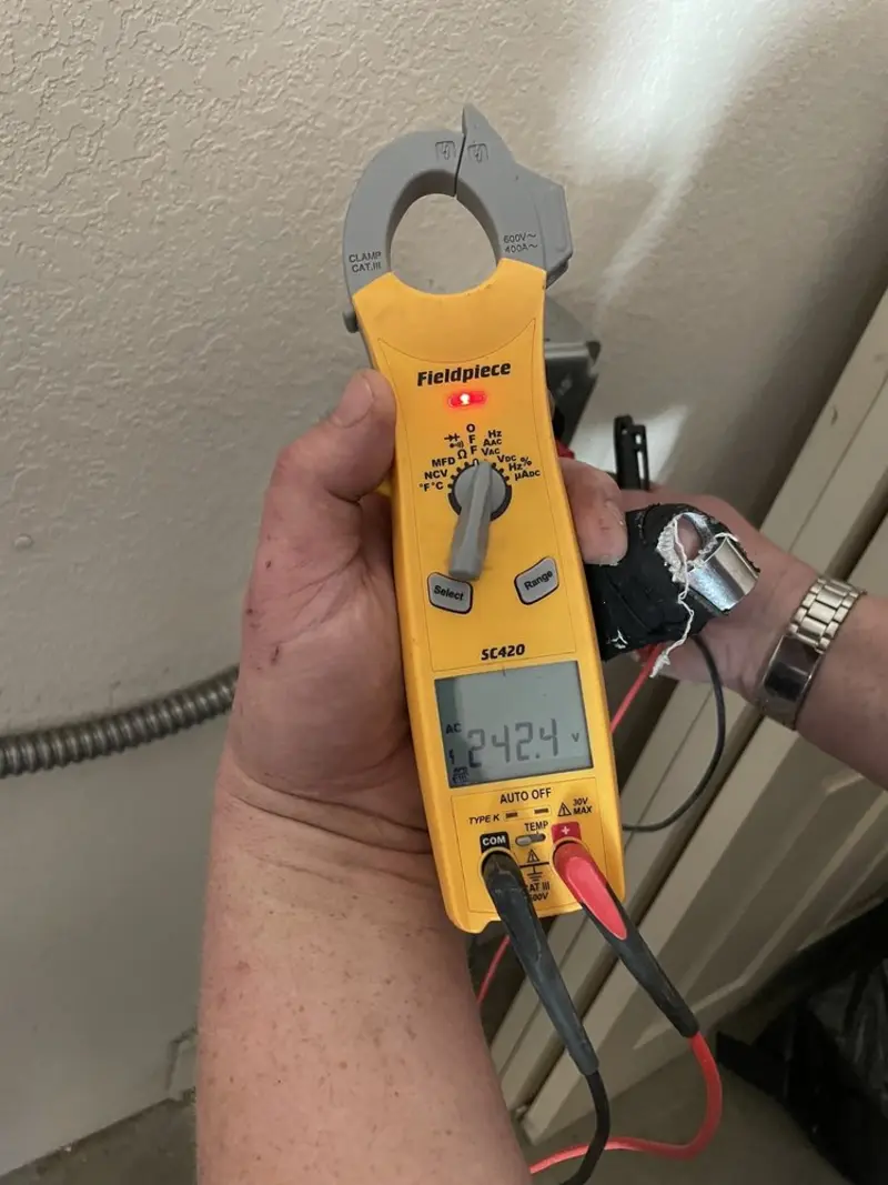 Voltage testing with clamp meter during Circuit Breaker Repair in Azle